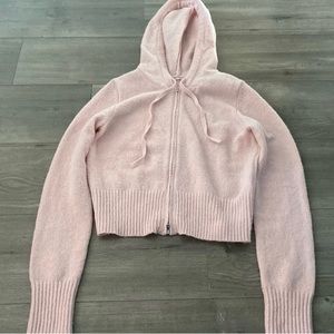 Pink zip up hoodie. Garage brand. Never worn. Size large.